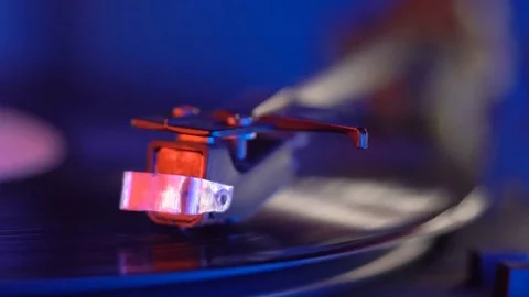 Vinyl record player, bright lights disco-bokeh. 4K Stock Footage 85356377
