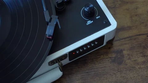 Vinyl record player needle dropping on spinning record, top view Stock Footage 337549591