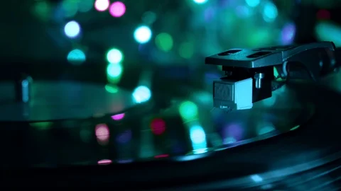 Vinyl record player. Needle drops. Night cold neon lights background. Stock Footage 96382335