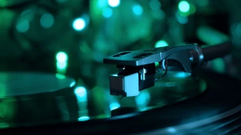 Vinyl record player. Stylus drops. Night cold neon lights background. Stock Footage 96382709