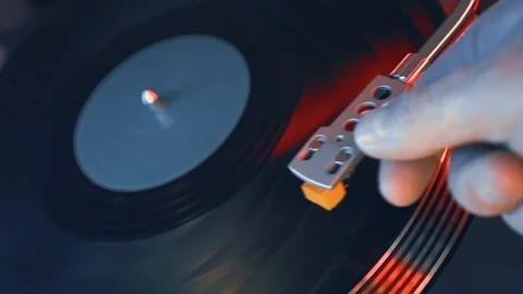 Vinyl record player turntable close-up on a background of red and blue lights Stock Footage 91680383