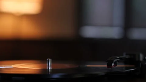 Vinyl Record Playing on Turntable in Darkened Room 動画素材 236771894