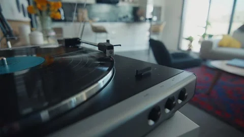 Vinyl record playing on turntable in modern living room Stock Footage 306581860