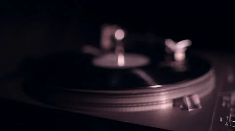 Vinyl record playing in turntable, slider shot Stock Footage 56675471
