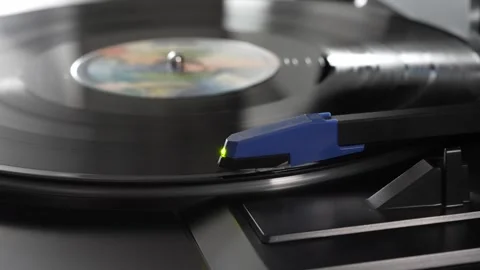 Vinyl Record Playing on Turntable with Tonearm in View Stock Footage 333757569