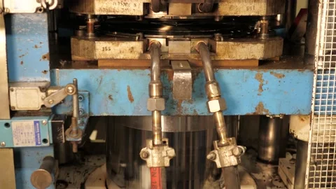 Vinyl record pressing machine in action, Making music record in a vinyl factory Stock Footage 157712512