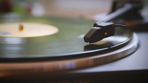 The vinyl record is spinning. The needle plays on a vintage vinyl record Video stock 147151375