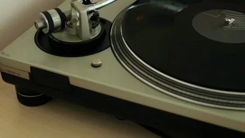 The vinyl record is spinning on the player (gramophone), dj installation Stock Footage 105547872