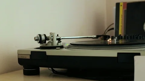 The vinyl record is spinning on the player (gramophone), dj installation Stock Footage 105547893