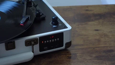 Vinyl record spinning on portable turntable close up Stock Footage 337545918