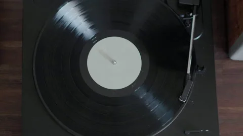 Vinyl record spinning on record player 動画素材 169063919