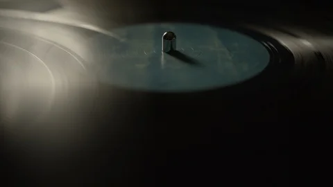 Vinyl record spinning on a turntable Stock Footage 129586911
