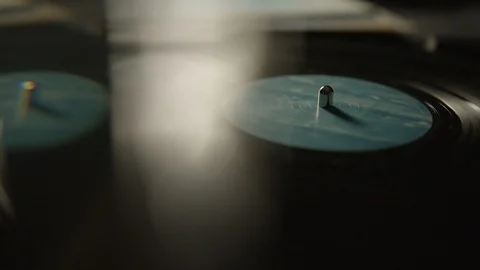 Vinyl record spinning on a turntable Stock Footage 129587899