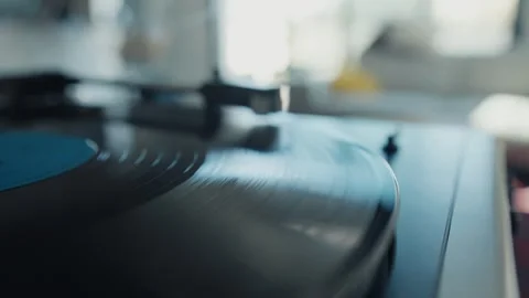 Vinyl record spinning on turntable playing music Stock Footage 306581479
