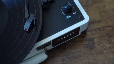 Vinyl record spinning on turntable top view. Analog music playback close up Stock Footage 337545144