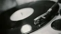 Vinyl record spinning on vintage phonograph, old music playing at retro party HD Footage