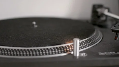 Vinyl record started on turntable stylus placed on record Stock Footage 88975904