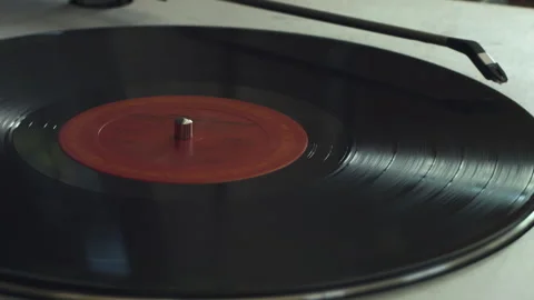 A Vinyl Record Starts Playing on a Record Player Stock Footage 130680244