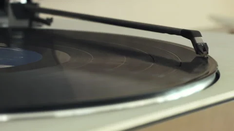 A Vinyl Record Starts Playing on a Record Player Stock Footage 130681129