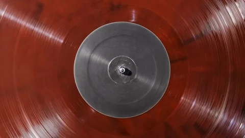 The vinyl record turntable record player close up. Red vinyl gray screen center Stock Footage 117593989