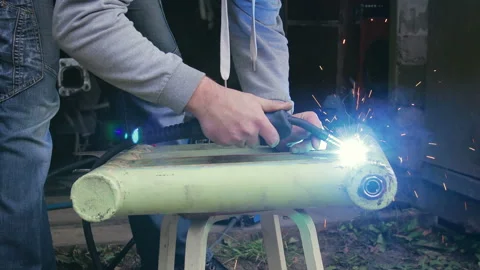 Violation of safety regulations when working with the welding machine Stock Footage 97088762