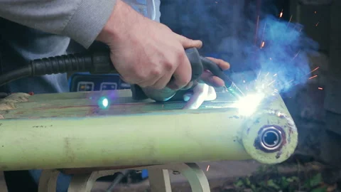 Violation of safety regulations when working with the welding machine Stock-Footage 97089325