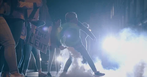 Violent activist throwing a smoke grenade Stock-Footage 129387685