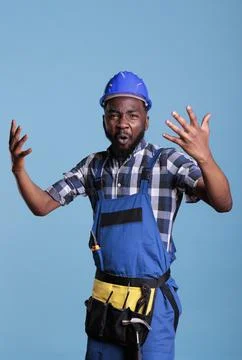 Violent and angry builder expressing anger Stock Photos