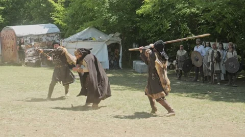 Violent beating of man with sticks, ancient re-enactment scene Bulgaria Stock Footage 192877182