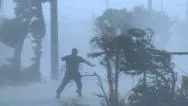 Violent Hurricane Eye Wall Winds Lash Man On Street Stock Footage