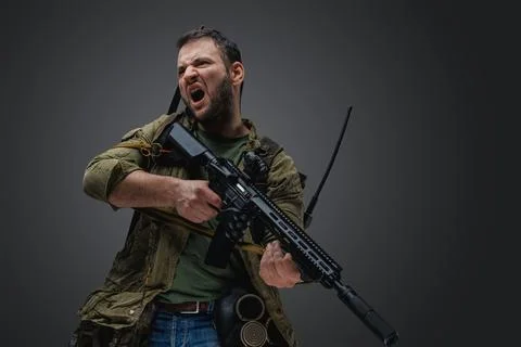 Violent man with rifle in style of post apocalypse Stock Photos