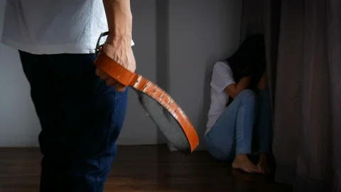 Violent men by using a belting belt and injuring women. Stock Footage 133168779