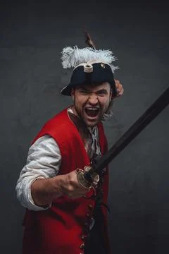 Violent pirate with red jacket and saber Stock Photos