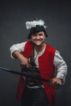 Violent pirate with red jacket and saber Stock Photos