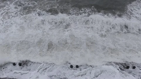 Violent sea waves crash against waterfront road as typhoon approaches coastal Stock Footage 340856655