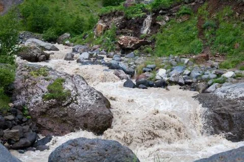 Violent streams of a mountain river Stock Photos