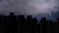 Violent thunderstorm breaks over megalopolis at night, lightning bolt with sound 4k or 4k+ Resolution