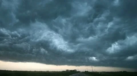Violent thunderstorm clouds rage across the sky Vidéo 10823627