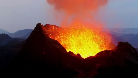 Violent volcanic eruption creates dynamic explosion of molten rock and lava.. Stock Footage 337764979