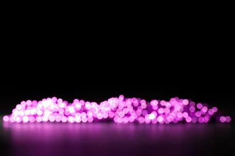 Violet beads on a dark background, defocused Stock Photos