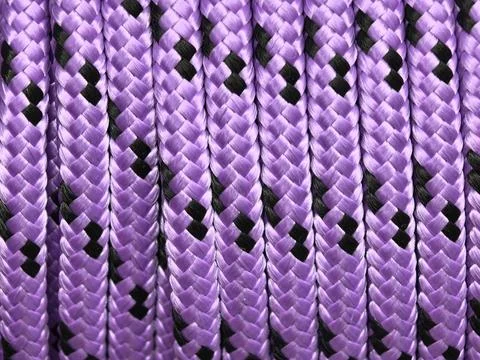 Violet braids weaving a bold pattern of light and shadow Stock Photos