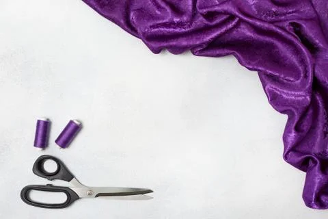 Violet cloth, scissors, thread Stock Photos