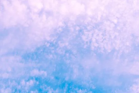 Violet clouds on blue sky. background texture. Stock Photos