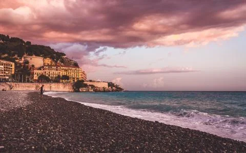Violet colored sunset on beach of Nice Stock Photos