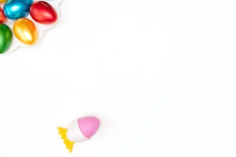 Violet easter egg in chicken stand on white background with painted easter eggs Stock Photos