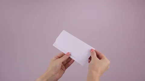Violet empty card in white envelope on a pink background Stock Footage 123163049