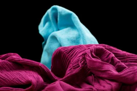 Violet fabric on a black background Stock Photos