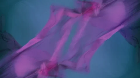 Violet fabric on a dark background Stock Footage 64535235