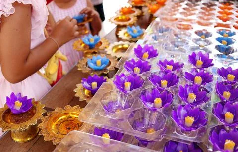 Violet flower shape candle. Stock Photos