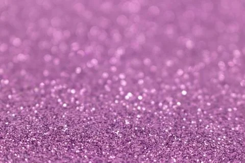 Violet glittering defocused background. Stock Photos